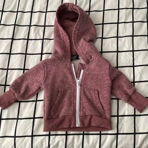 Little Bipsy zip up hoodie in a heathered pink color. Size 0-3 months